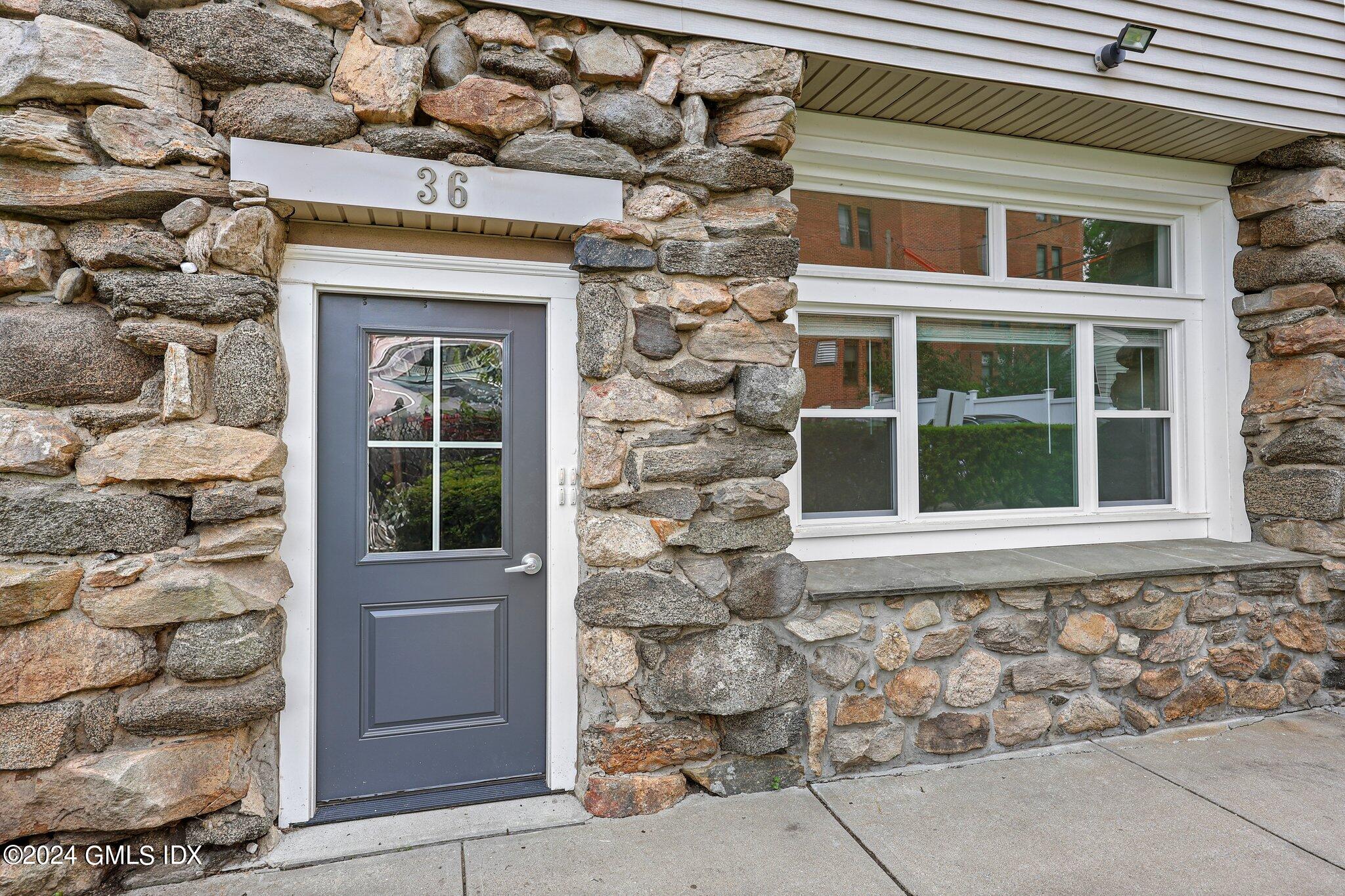 36 Arch Street, Unit 1A Greenwich, CT 06830 - Photo 3 of 19 a front view of a house with a window