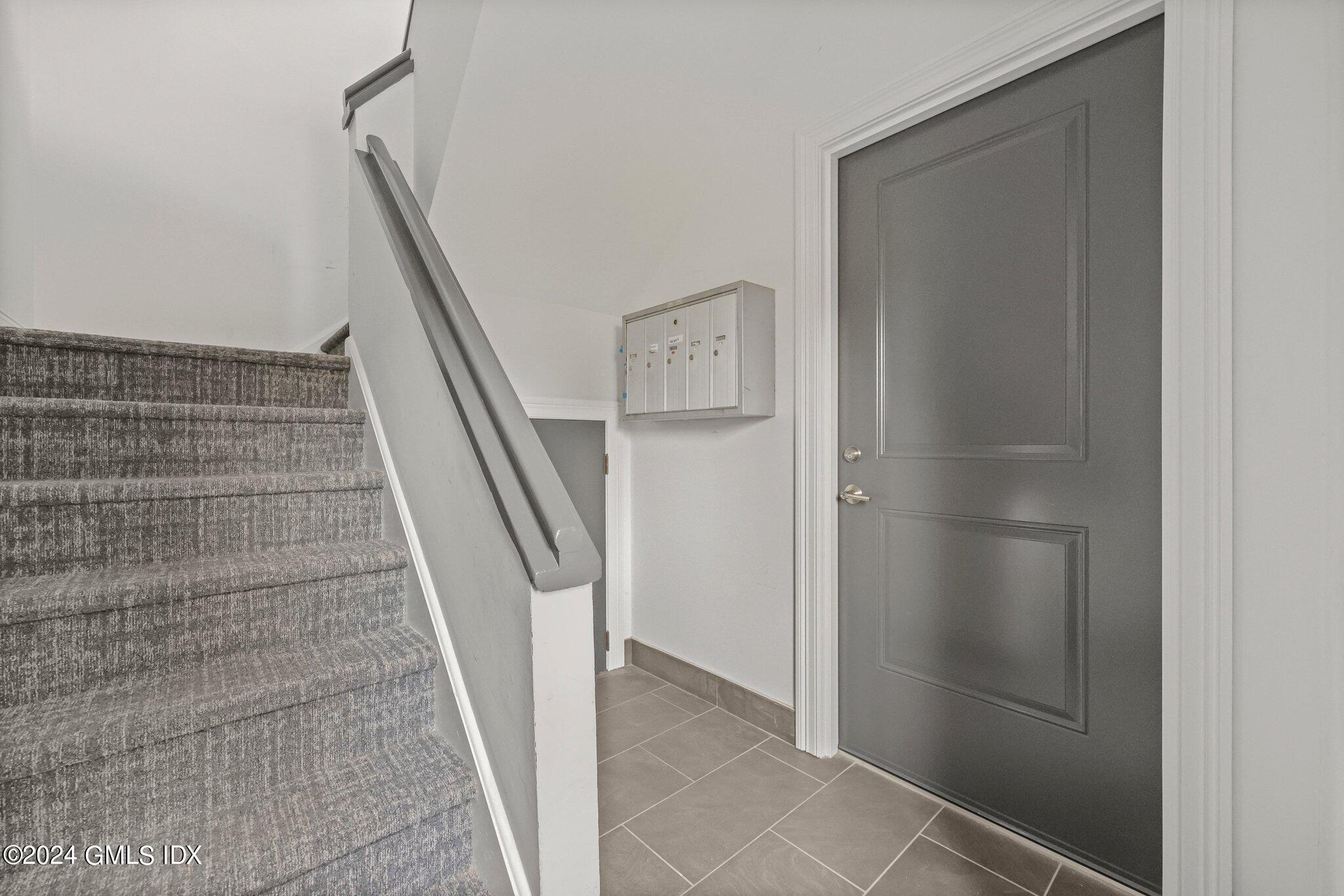 36 Arch Street, Unit 1A Greenwich, CT 06830 - Photo 4 of 19 a view of entryway with stairs