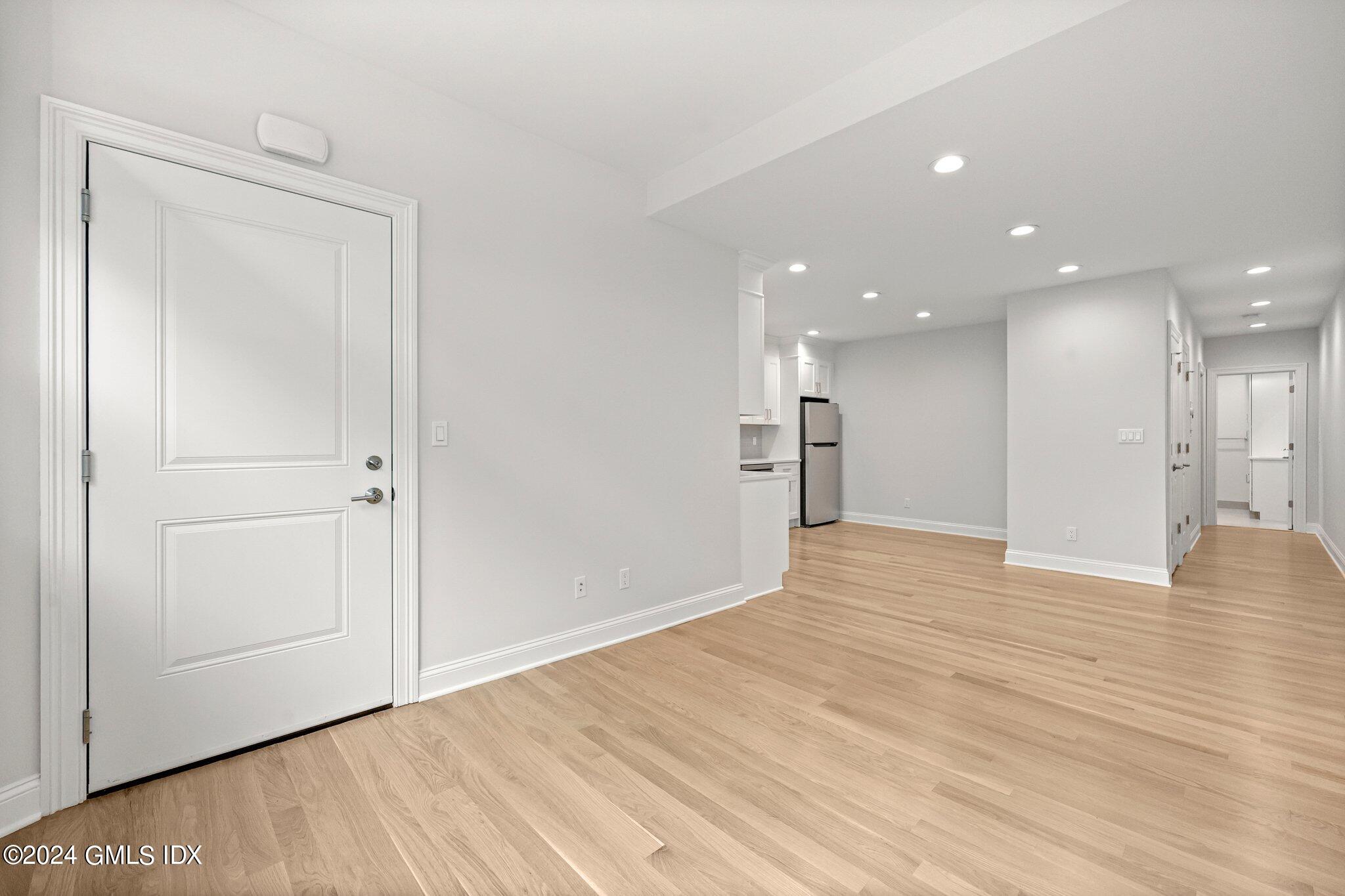 36 Arch Street, Unit 1A Greenwich, CT 06830 - Photo 5 of 19 a view of empty room with wooden floor