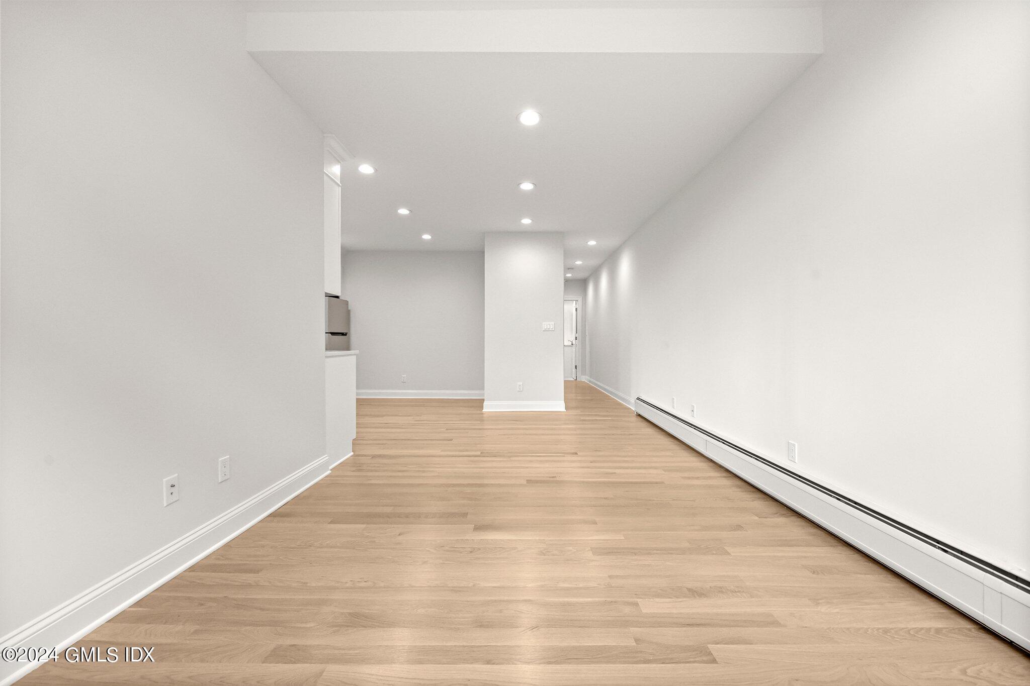 36 Arch Street, Unit 1A Greenwich, CT 06830 - Photo 6 of 19 a view of hallway with wooden floor