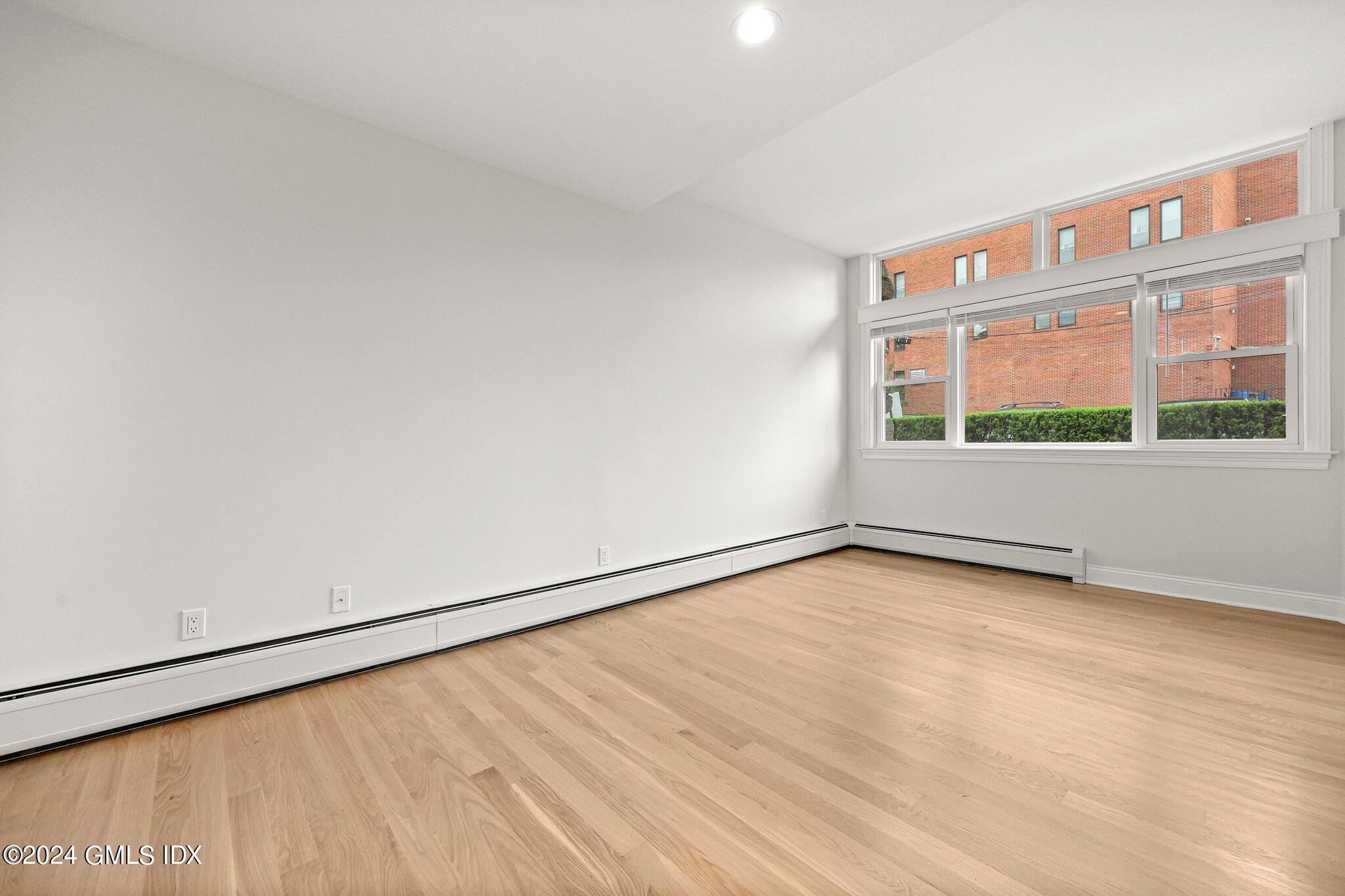 36 Arch Street, Unit 1A Greenwich, CT 06830 - Photo 8 of 19 a view of an empty room with a window