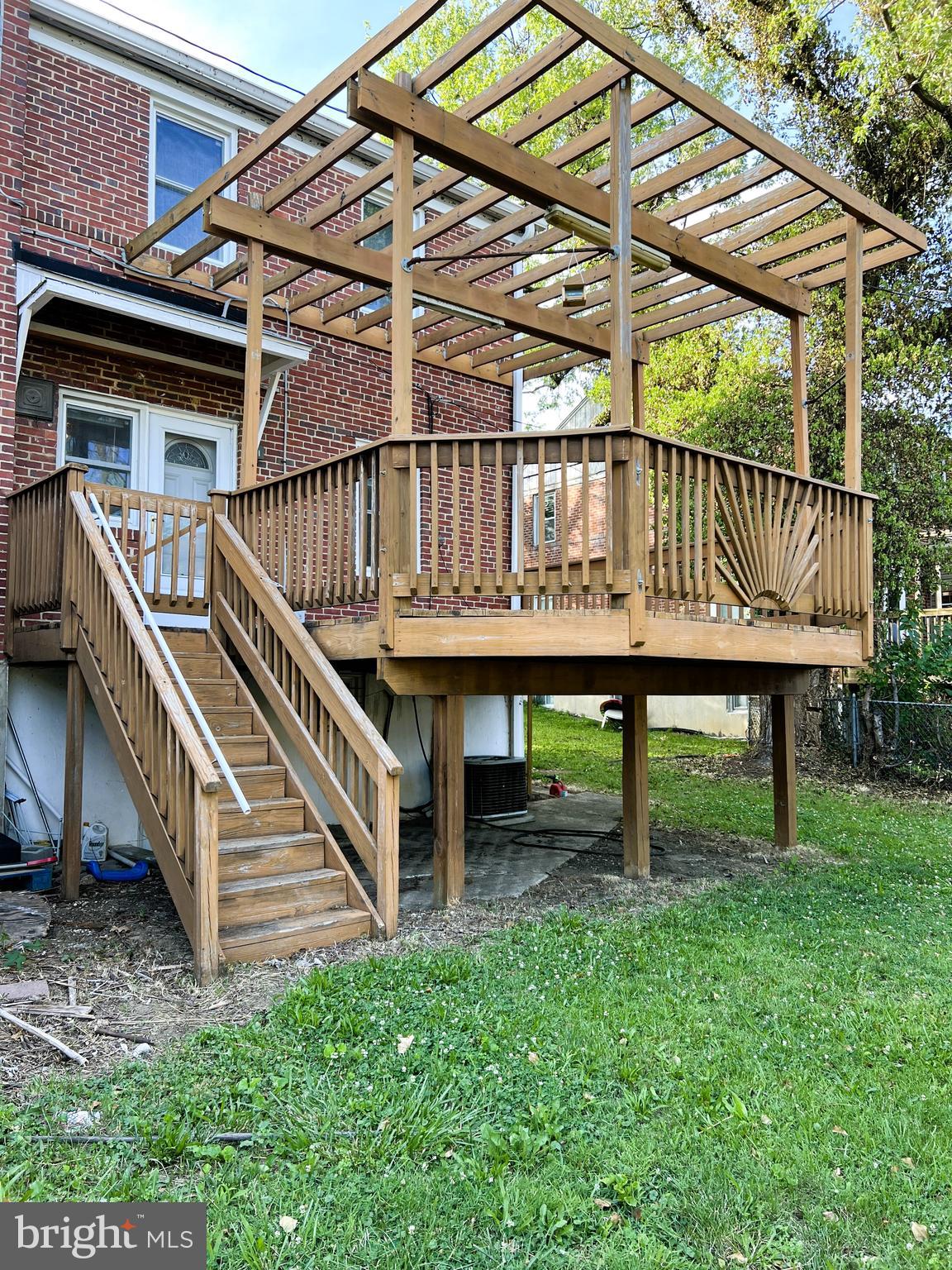 3705 Bancroft Road Baltimore, MD 21215 - Photo 45 of 50 a view of a house with a yard and a deck