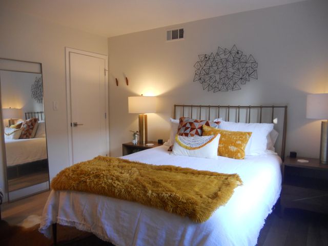 a bedroom with a bed and a table in it