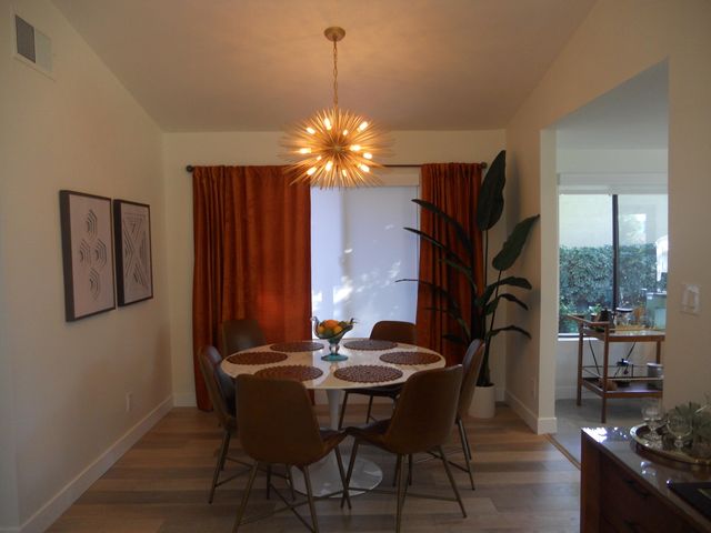 a view of a dining room with furniture window and outside view