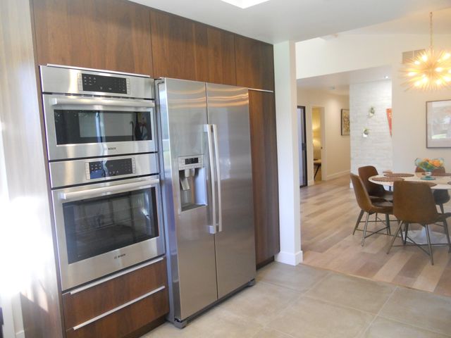 a kitchen with a stove and a microwave