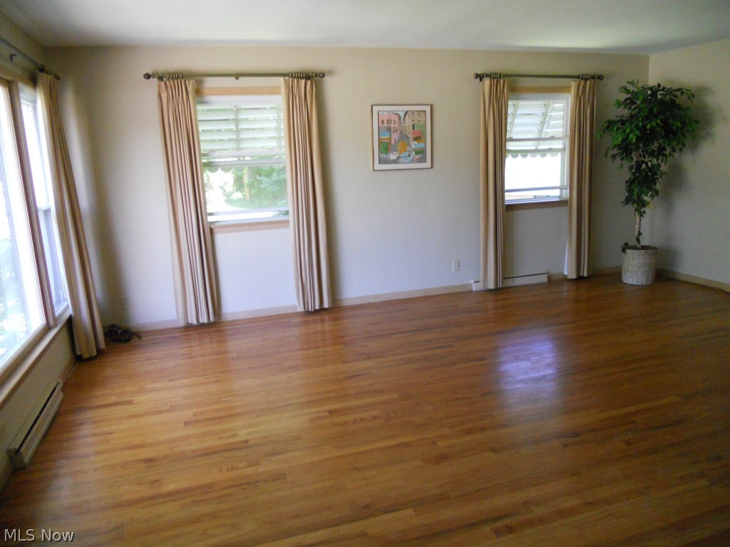 5016 North Sedgewick Road Cleveland, OH 44124 - Photo 3 of 22 Light and Bright Living Room with Lots of Windows and Gleaming Hardwood Floors