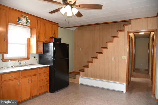 a bathroom with a sink a mirror and a shower