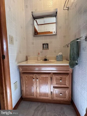 a room with a fireplace and a mirror