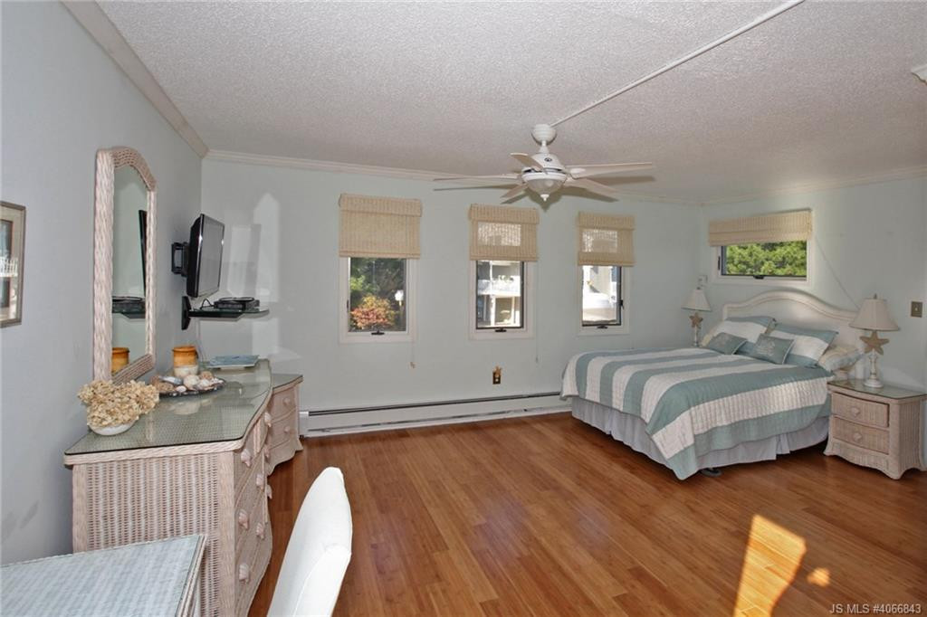 Undisclosed Address Beach Haven, NJ 08008 - Photo 15 of 36 a bedroom with a bed window and furniture