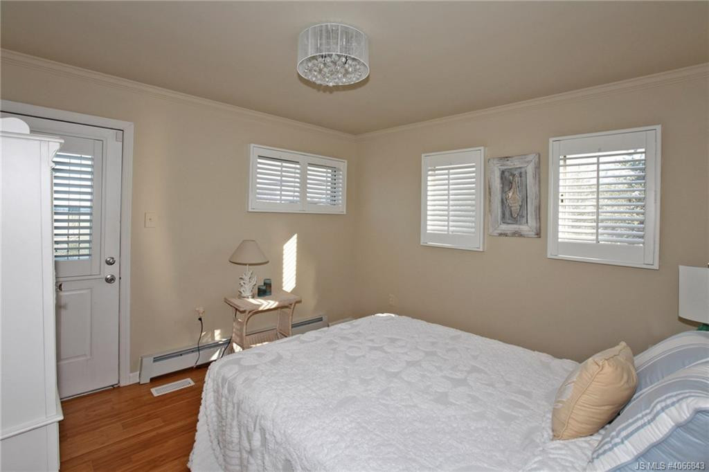Undisclosed Address Beach Haven, NJ 08008 - Photo 19 of 36 a bedroom with a bed and a window