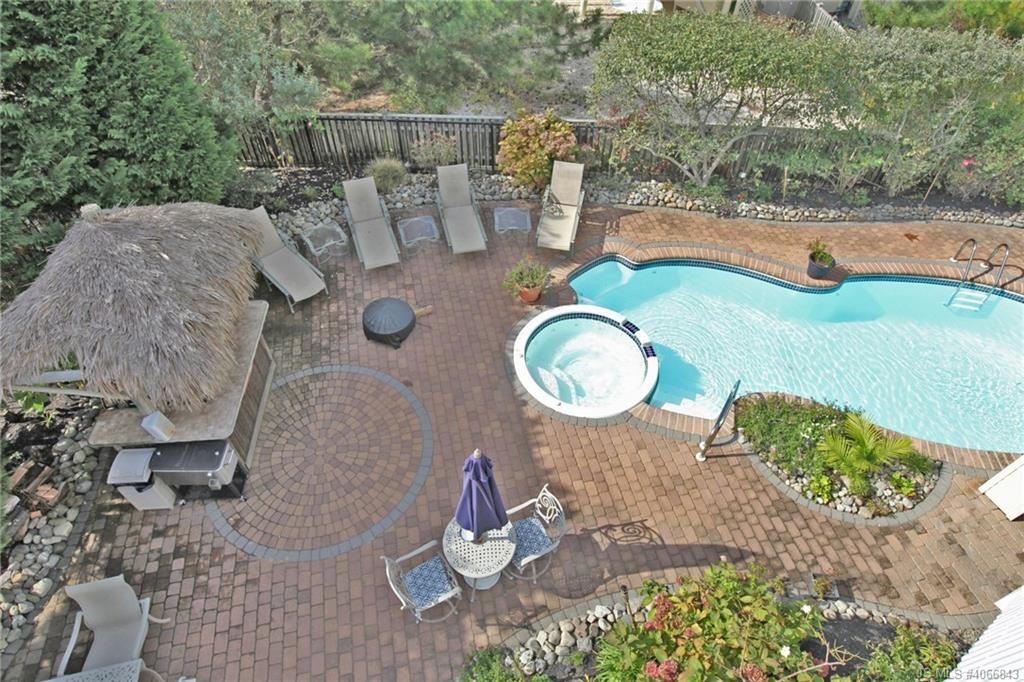 Undisclosed Address Beach Haven, NJ 08008 - Photo 2 of 36 a backyard of a house with table and chairs