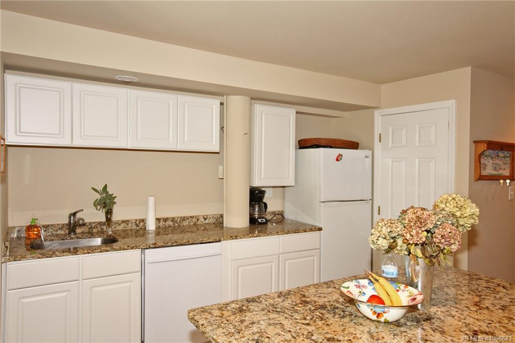 Undisclosed Address Beach Haven, NJ 08008 - Photo 22 of 36 a kitchen with stainless steel appliances granite countertop a sink cabinets and a refrigerator