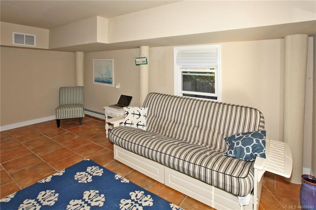 Undisclosed Address Beach Haven, NJ 08008 - Photo 25 of 36 a bedroom with a bed and glass door