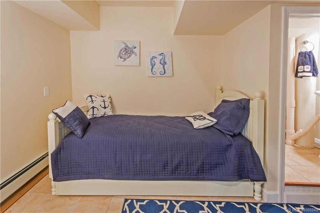 Undisclosed Address Beach Haven, NJ 08008 - Photo 26 of 36 a bedroom with a bed and a painting on the wall