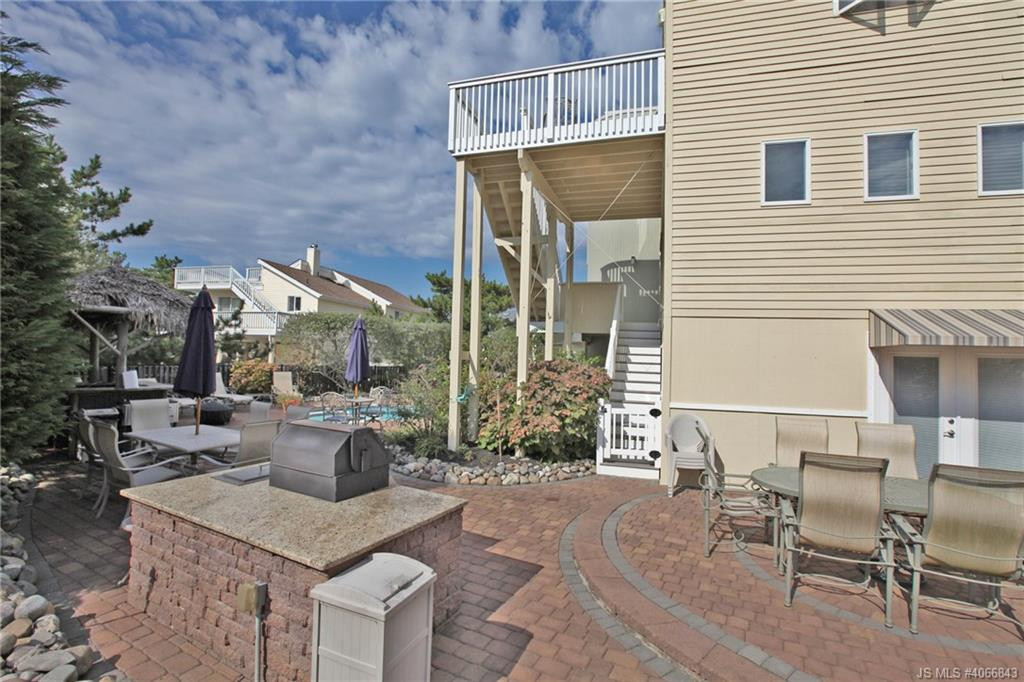 Undisclosed Address Beach Haven, NJ 08008 - Photo 30 of 36 a view of a patio with couches table and chairs and potted plants