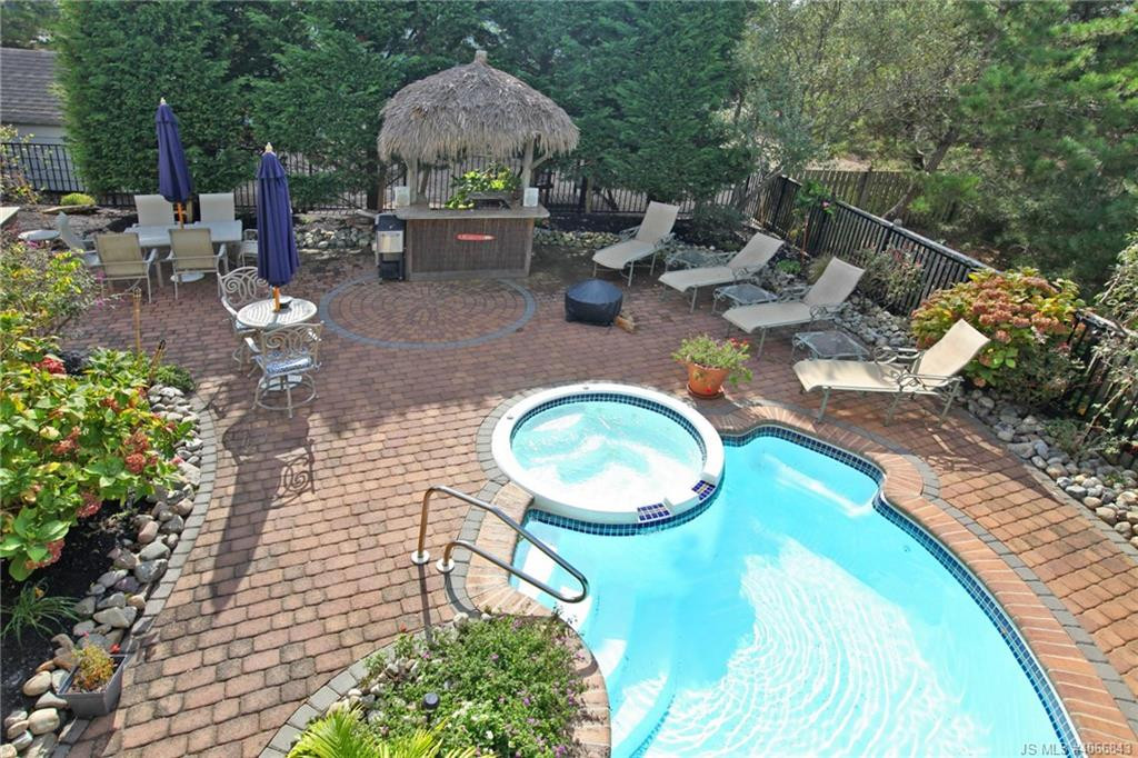 Undisclosed Address Beach Haven, NJ 08008 - Photo 32 of 36 a backyard of a house with table and chairs