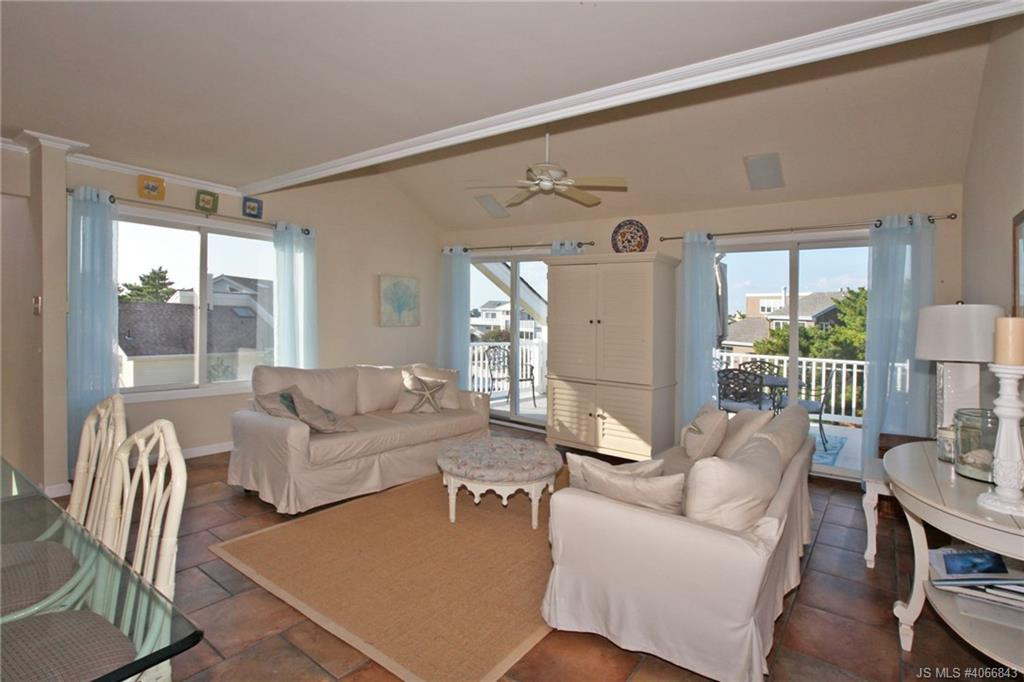Undisclosed Address Beach Haven, NJ 08008 - Photo 4 of 36 a living room with furniture and a large window