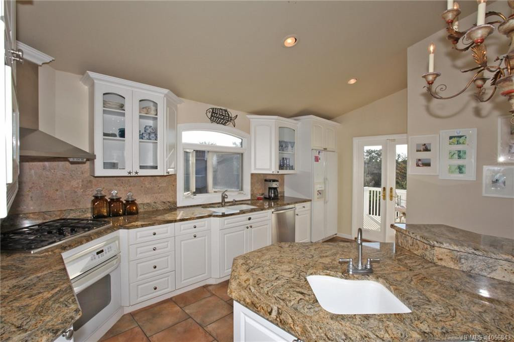Undisclosed Address Beach Haven, NJ 08008 - Photo 6 of 36 a kitchen with stainless steel appliances granite countertop a sink and cabinets