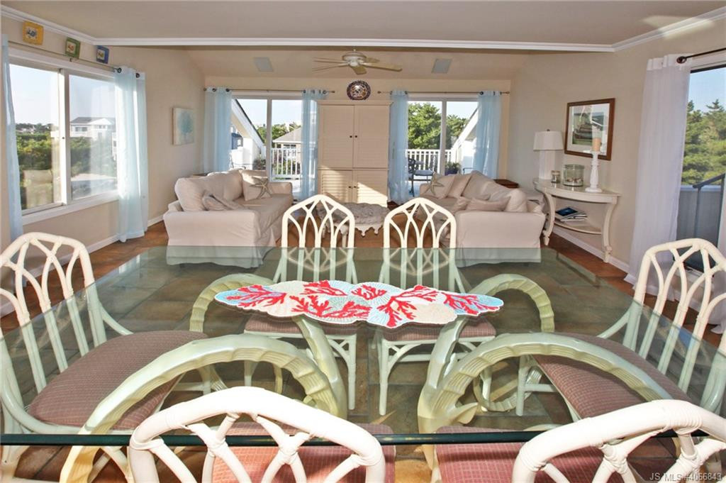 Undisclosed Address Beach Haven, NJ 08008 - Photo 9 of 36 a bedroom with furniture and a large window