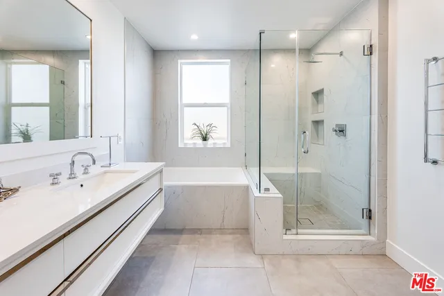 a bathroom with a bathtub and a sink