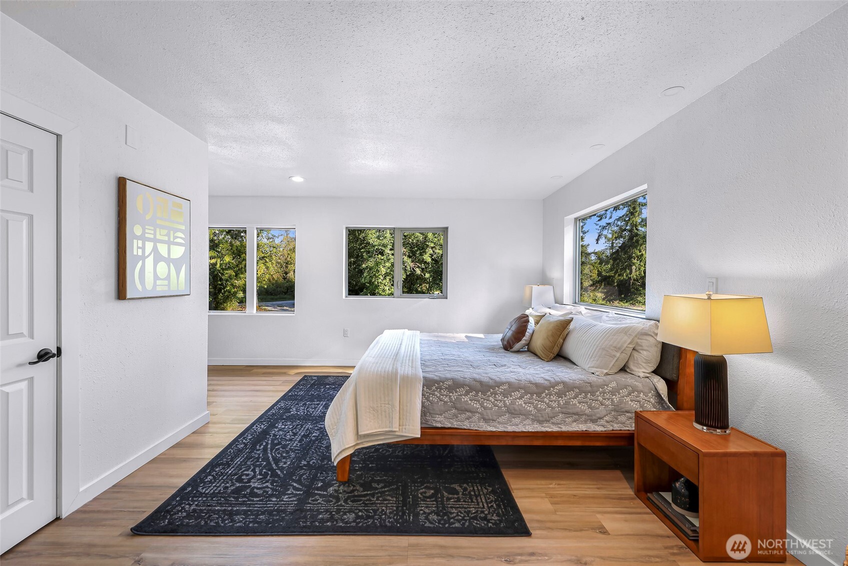 4104 Loomis Trail Road Blaine, WA 98230 - Photo 19 of 40 a bedroom with a bed rug and wooden floor