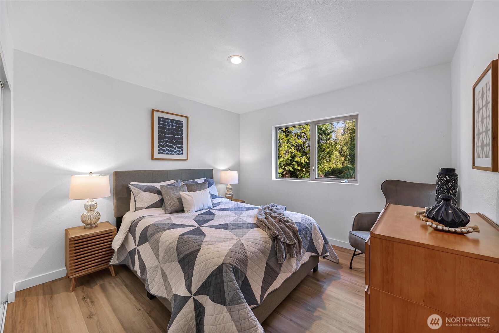 4104 Loomis Trail Road Blaine, WA 98230 - Photo 25 of 40 a bedroom with a bed and wooden floor