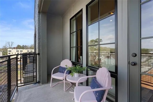 a bathroom with a sink a toilet a mirror and shower