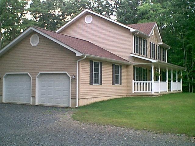 14 Antler Road Bartonsville, PA 18321 - Photo 3 of 9 a front view of a house with a garden