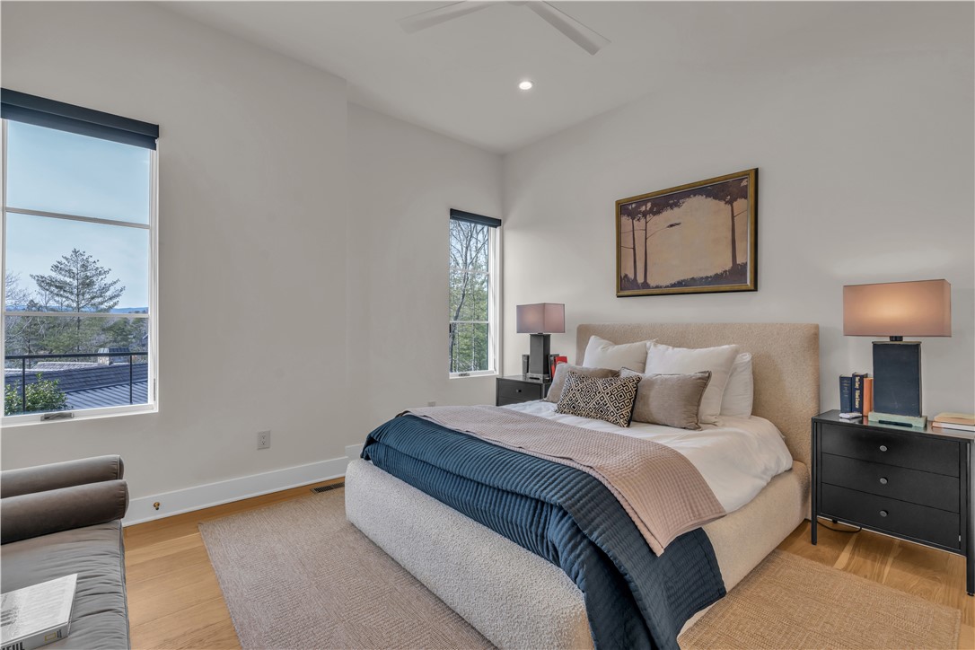 127 Crosswind Court Sunset, SC 29685 - Photo 36 of 49 This peaceful bedroom offers a bright ambiance with wood floors and abundant natural light.
