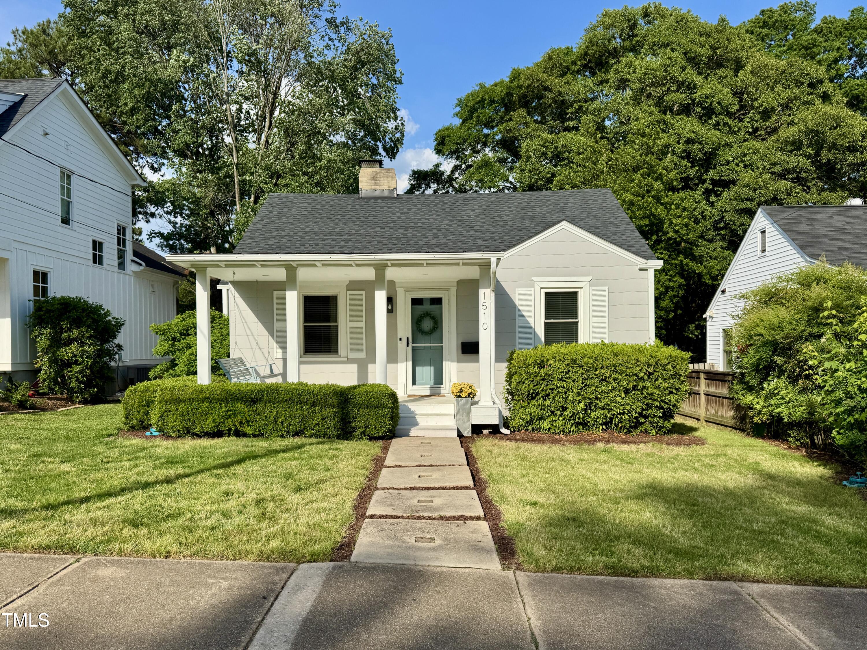 1510 Hanover Street Raleigh, NC 27608 - Photo 1 of 22 front view of a house and a yard