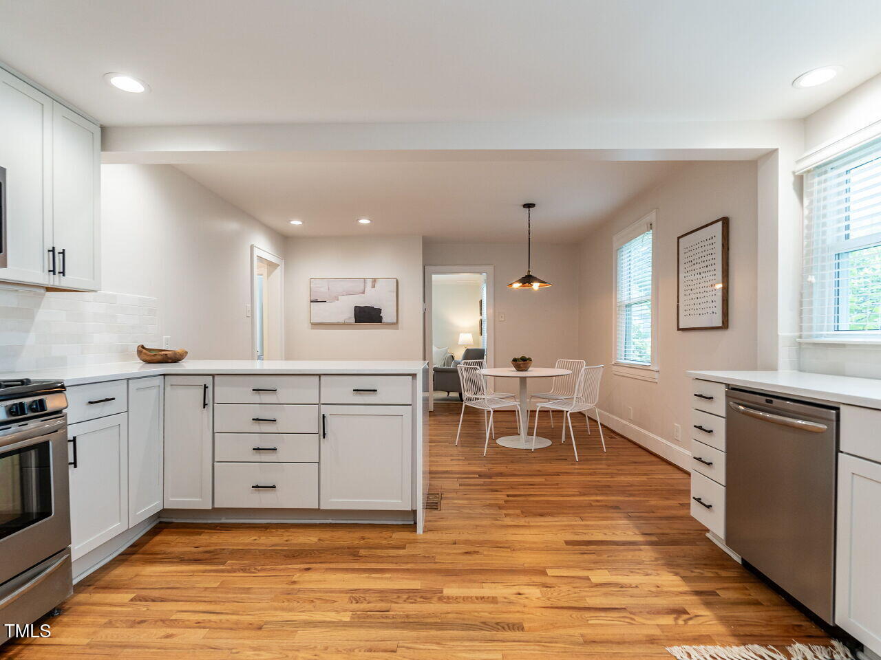 1510 Hanover Street Raleigh, NC 27608 - Photo 10 of 22 a large white kitchen with cabinets