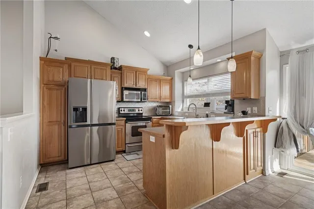 $360,000 | 607 Bradford Court, Raymore, MO 64083