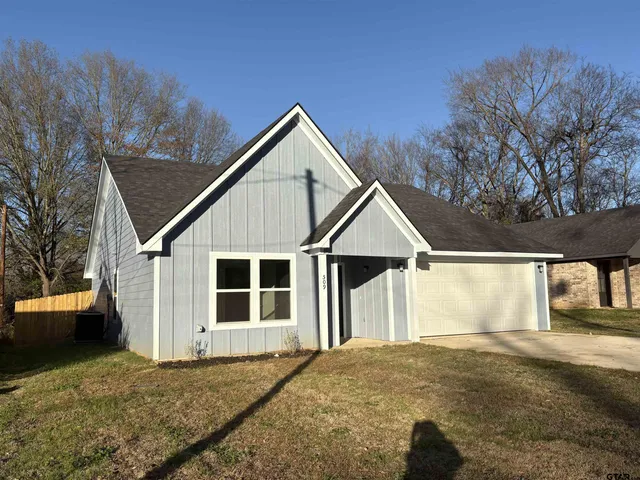a house with trees in the background