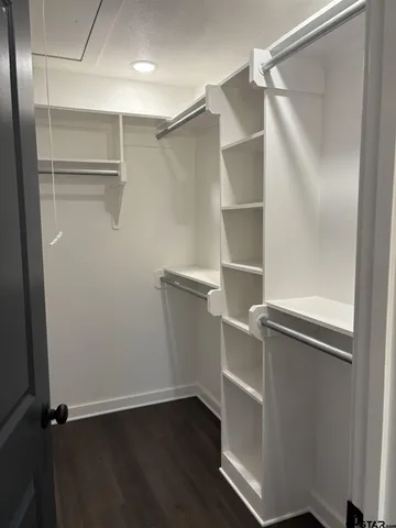 a view of an empty walk in closet