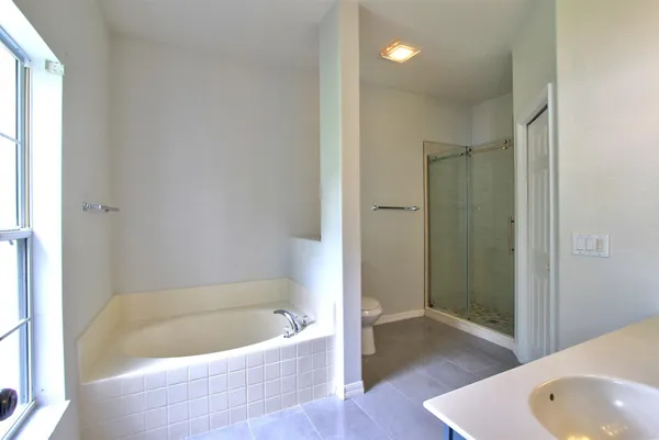 a view of a bathroom from a hallway
