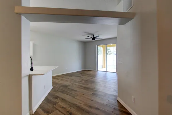 a view of an empty room with a window