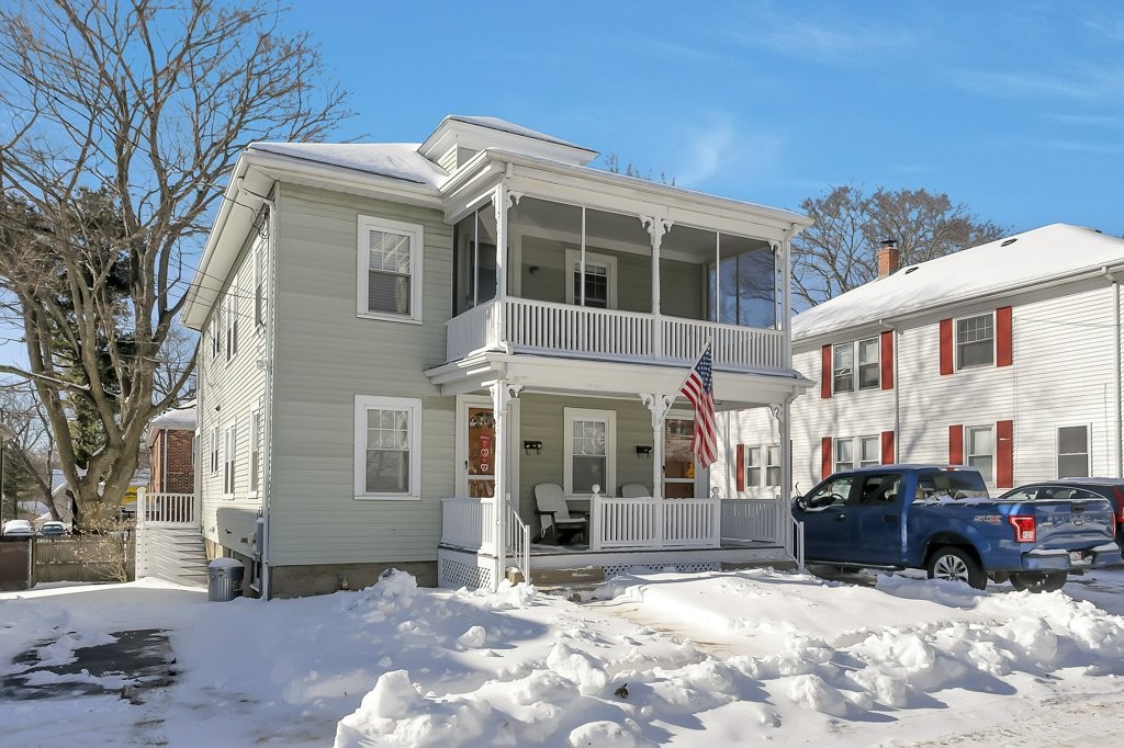 14 Russell Road, Unit 14 Winchester, MA 01890 - Photo 1 of 18 a view of a car park in front of a building