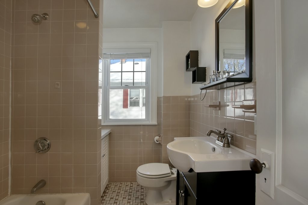 14 Russell Road, Unit 14 Winchester, MA 01890 - Photo 15 of 18 a bathroom with a sink toilet and shower