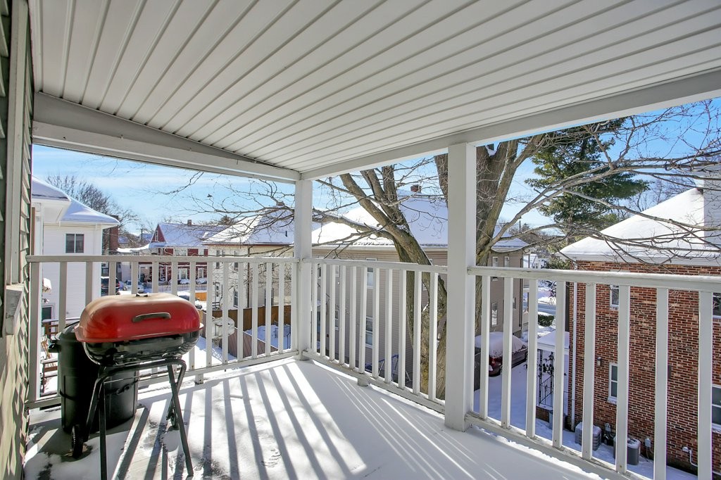 14 Russell Road, Unit 14 Winchester, MA 01890 - Photo 16 of 18 a view of a chairs and table in the balcony
