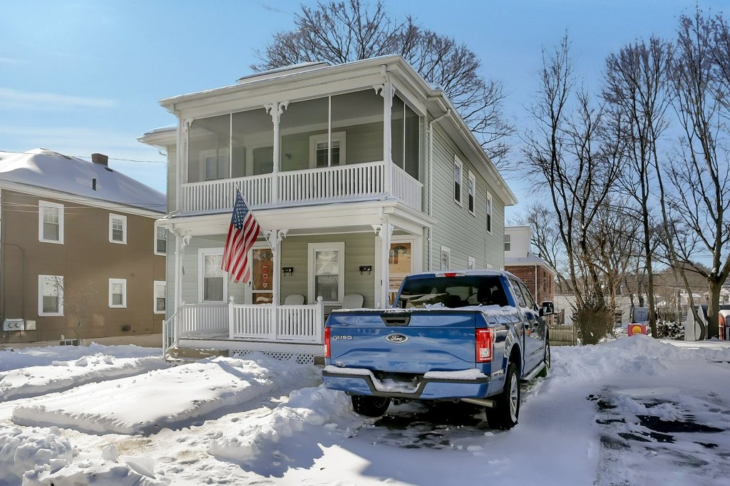 14 Russell Road, Unit 14 Winchester, MA 01890 - Photo 18 of 18 a car parked in front of a house