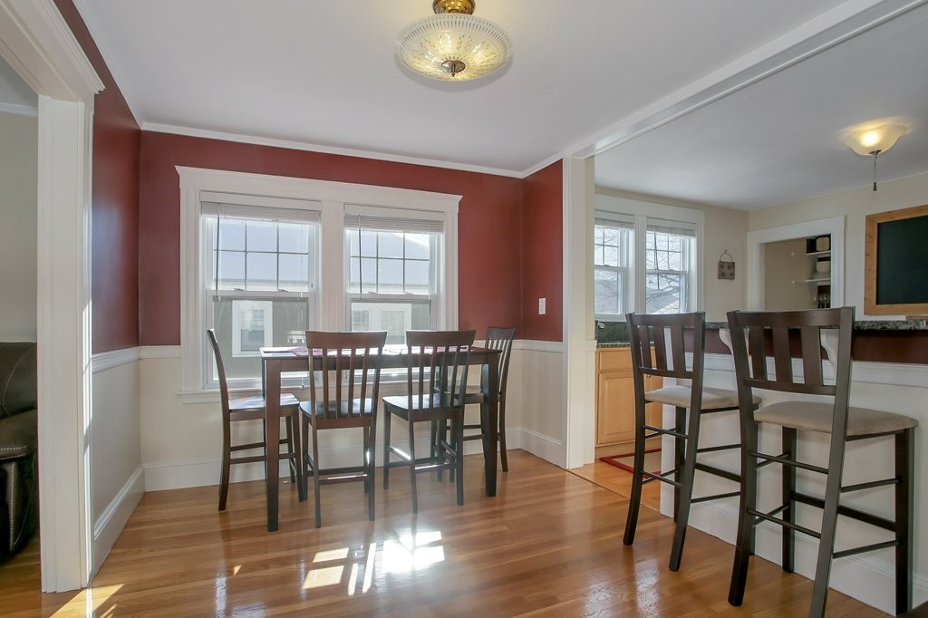 14 Russell Road, Unit 14 Winchester, MA 01890 - Photo 3 of 18 a view of a dining room with furniture and wooden floor