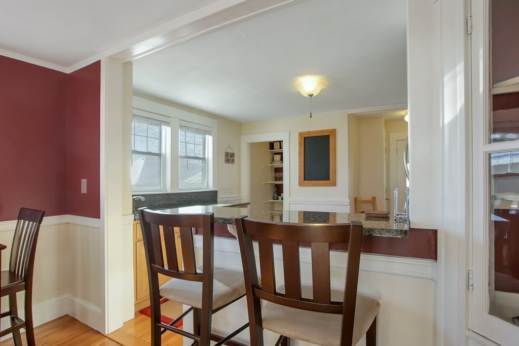 14 Russell Road, Unit 14 Winchester, MA 01890 - Photo 4 of 18 a view of a dining room with furniture and wooden floor