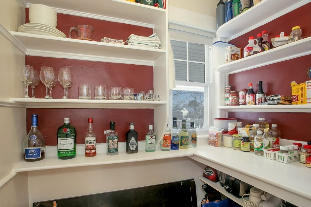 14 Russell Road, Unit 14 Winchester, MA 01890 - Photo 6 of 18 a kitchen with lots of clutter and cabinets
