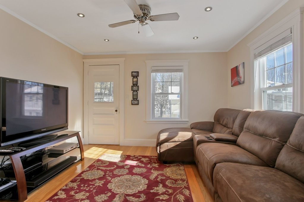 14 Russell Road, Unit 14 Winchester, MA 01890 - Photo 10 of 18 a living room with furniture and a flat screen tv