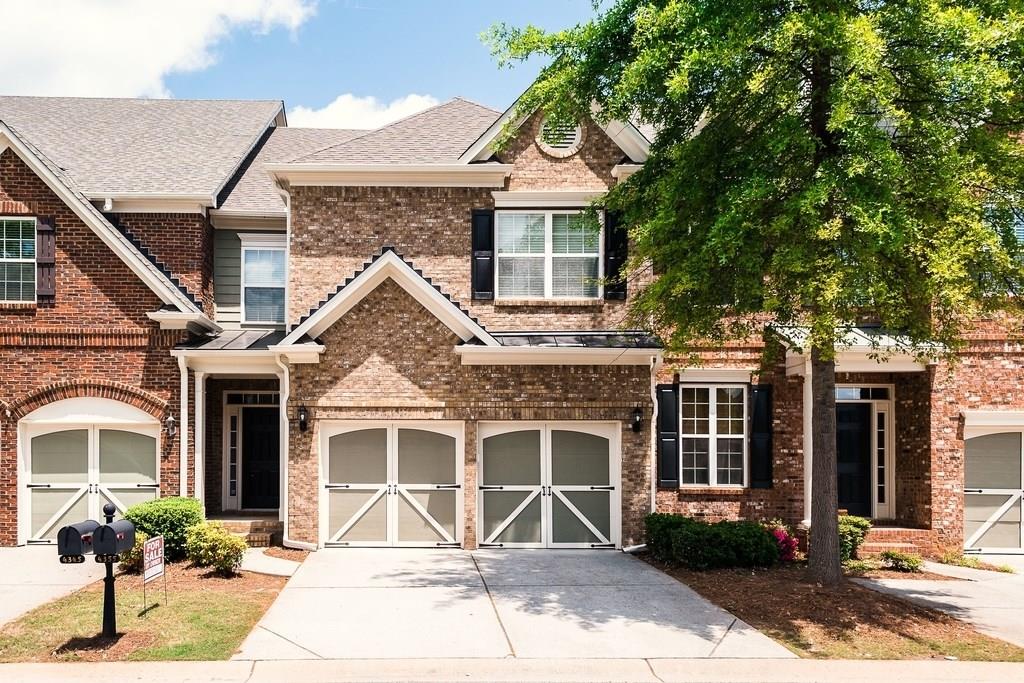 4355 Cold Spring Court Cumming, GA 30041 - Photo 1 of 1 a front view of a house with a garden