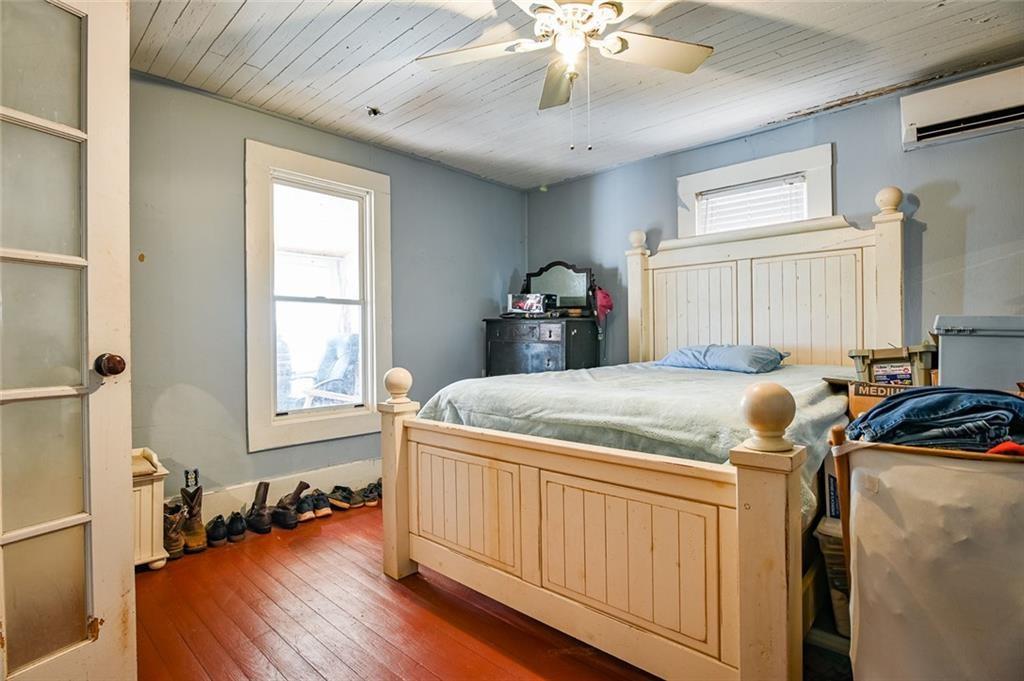 12462 Brown Bridge Road Covington, GA 30016 - Photo 8 of 31 a bedroom with a bed and a chandelier