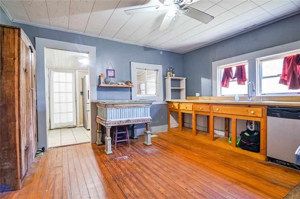 12462 Brown Bridge Road Covington, GA 30016 - Photo 9 of 31 a living room with furniture and a wooden floor