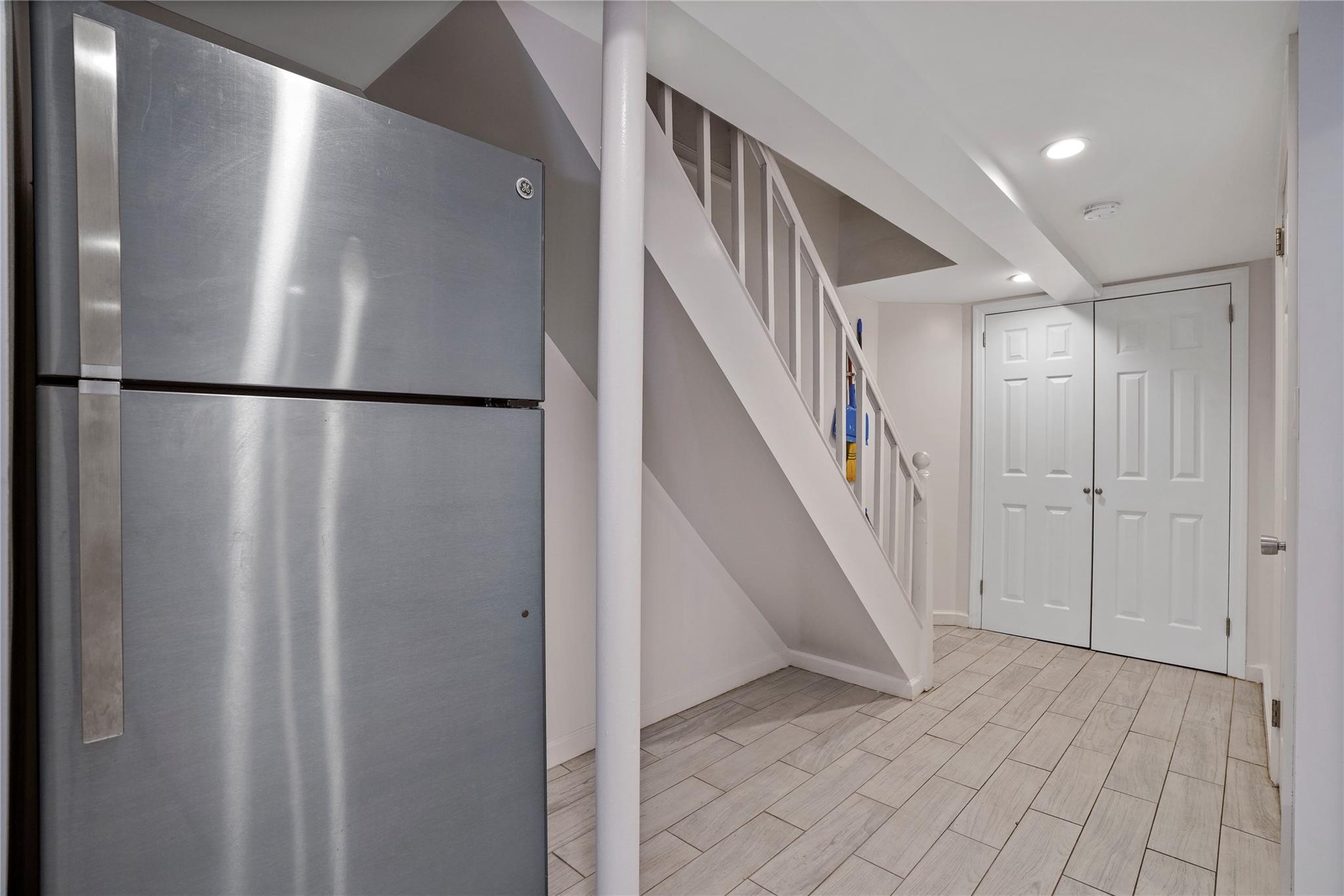 64-18 84th Place Queens, NY 11379 - Photo 19 of 35 a view of a hallway with staircase