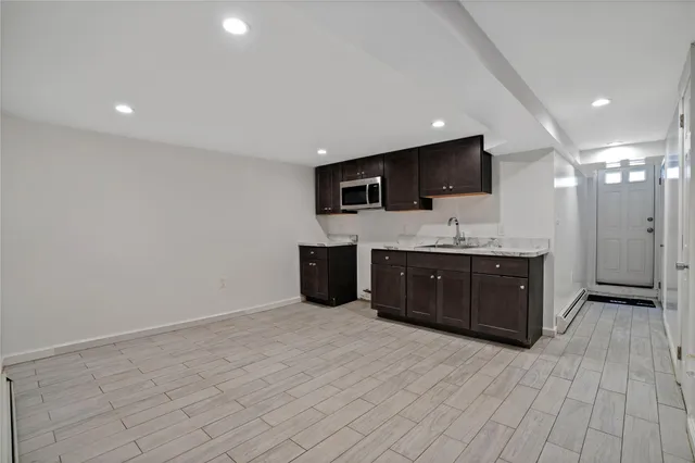 a room with a bed and television