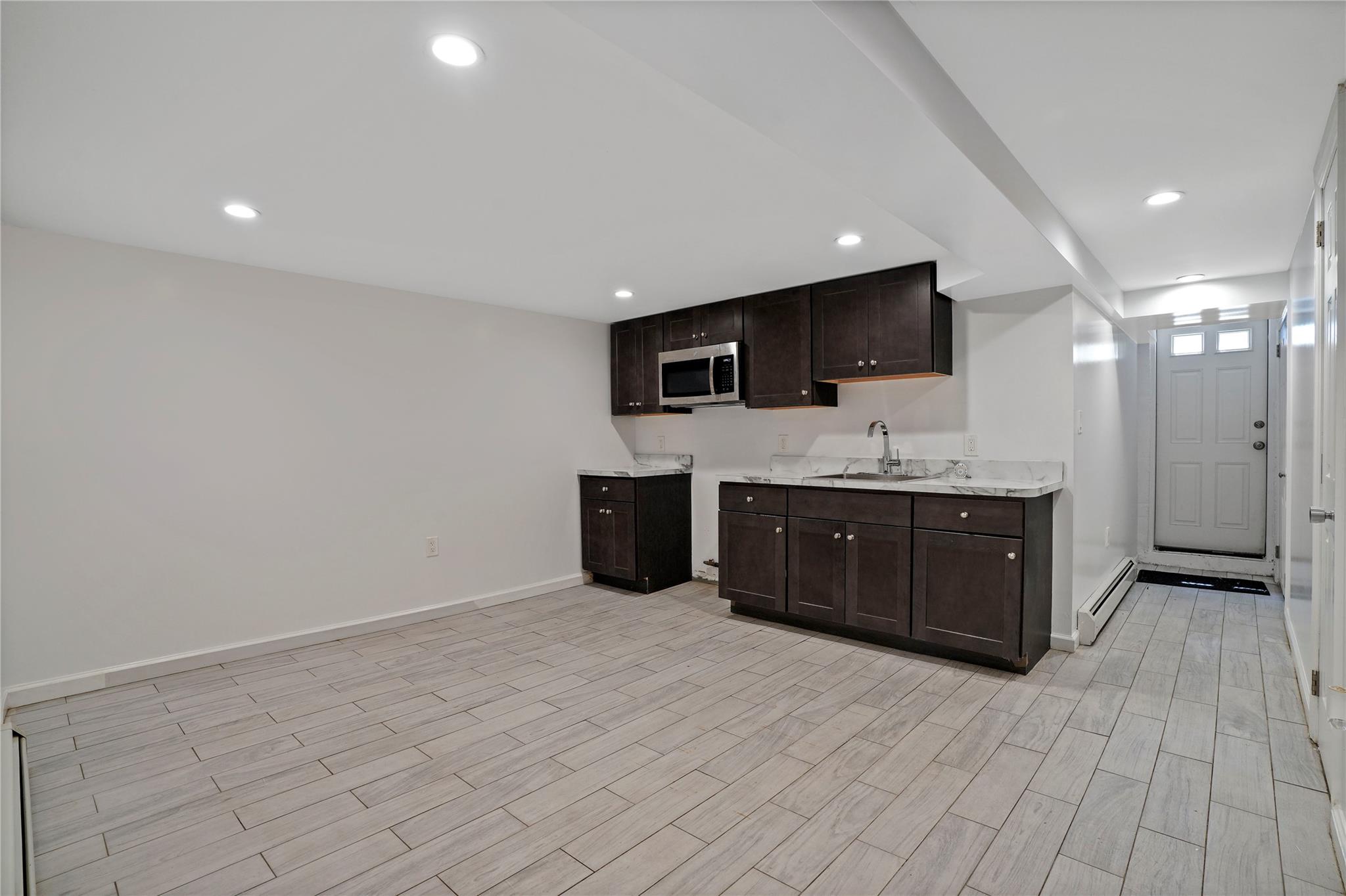 64-18 84th Place Queens, NY 11379 - Photo 20 of 35 a room with a bed and television